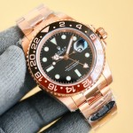 Rolex GMT-Master series, black dial, black and red bezel, 40mm, gold and silver Oyster bracelet.